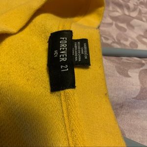 yellow shirt wit a little rose